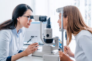 optometrist giving eye exam