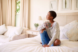 woman sitting on bed 