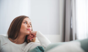 woman looking out window